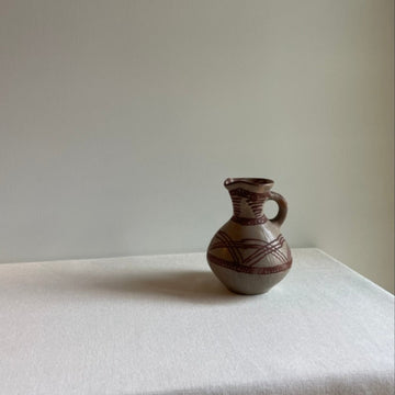 Vintage hand-painted clay vessel