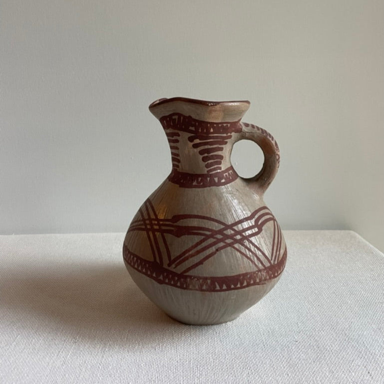 Vintage hand-painted clay vessel
