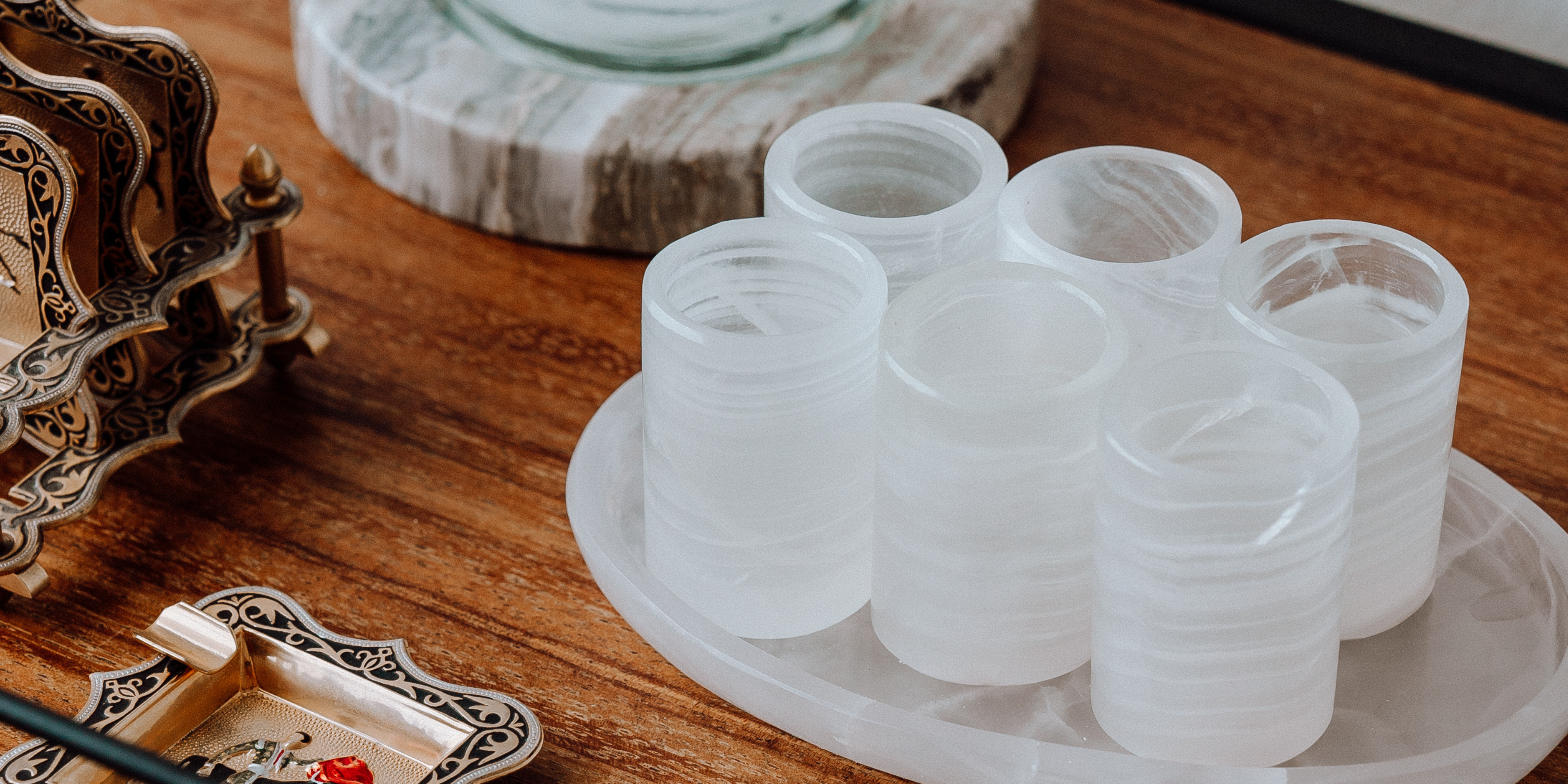 Stone shot glass set on bar cart