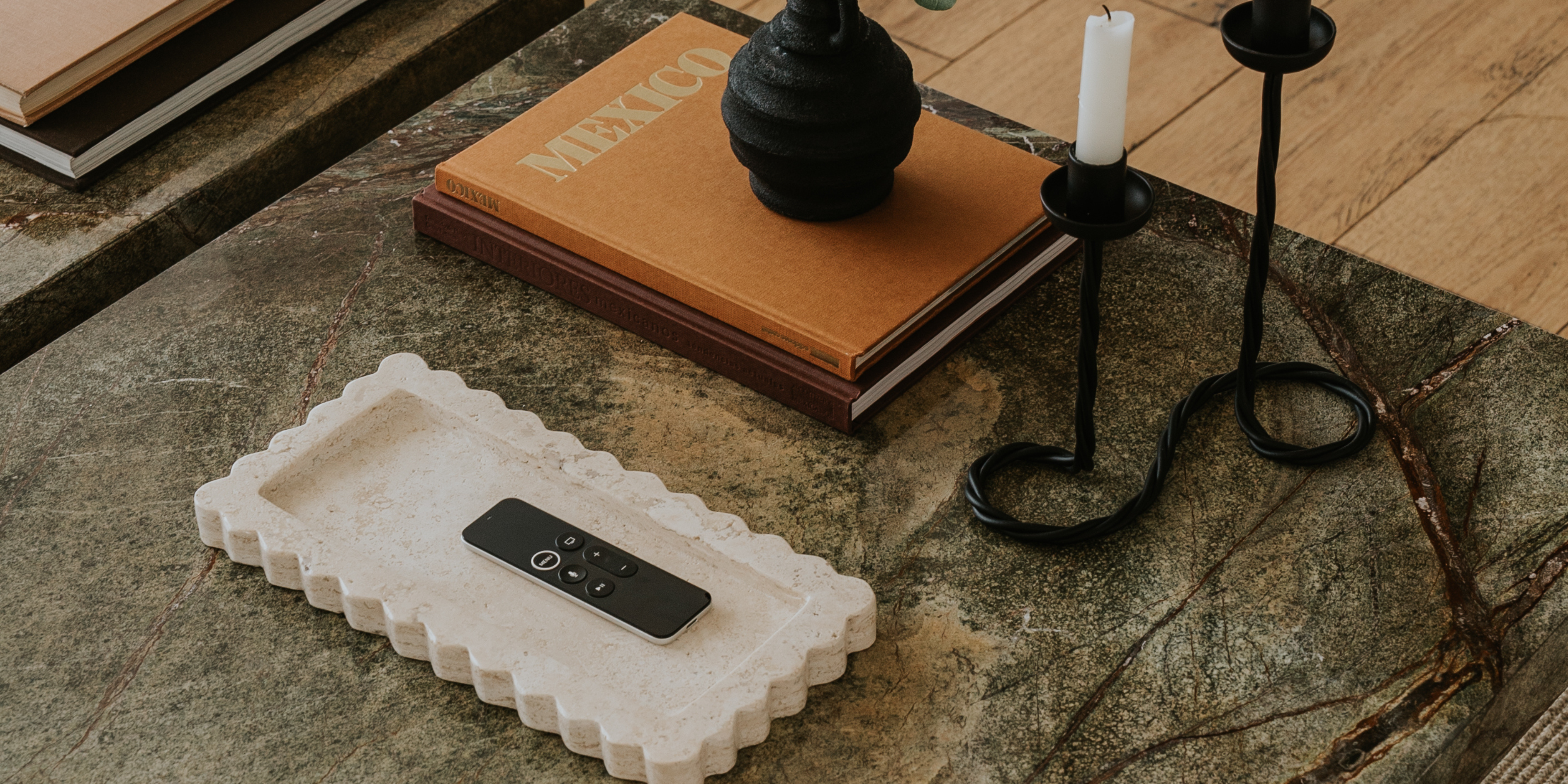 Natural marble valet tray styled on coffee table with coffee table book