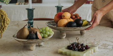 Sculptural stone dishes for displaying and serving food