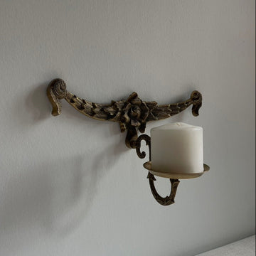 Bronze candle holder with flower detail