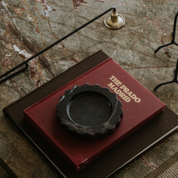 floral-inspired stone catchall tray styled on coffee table