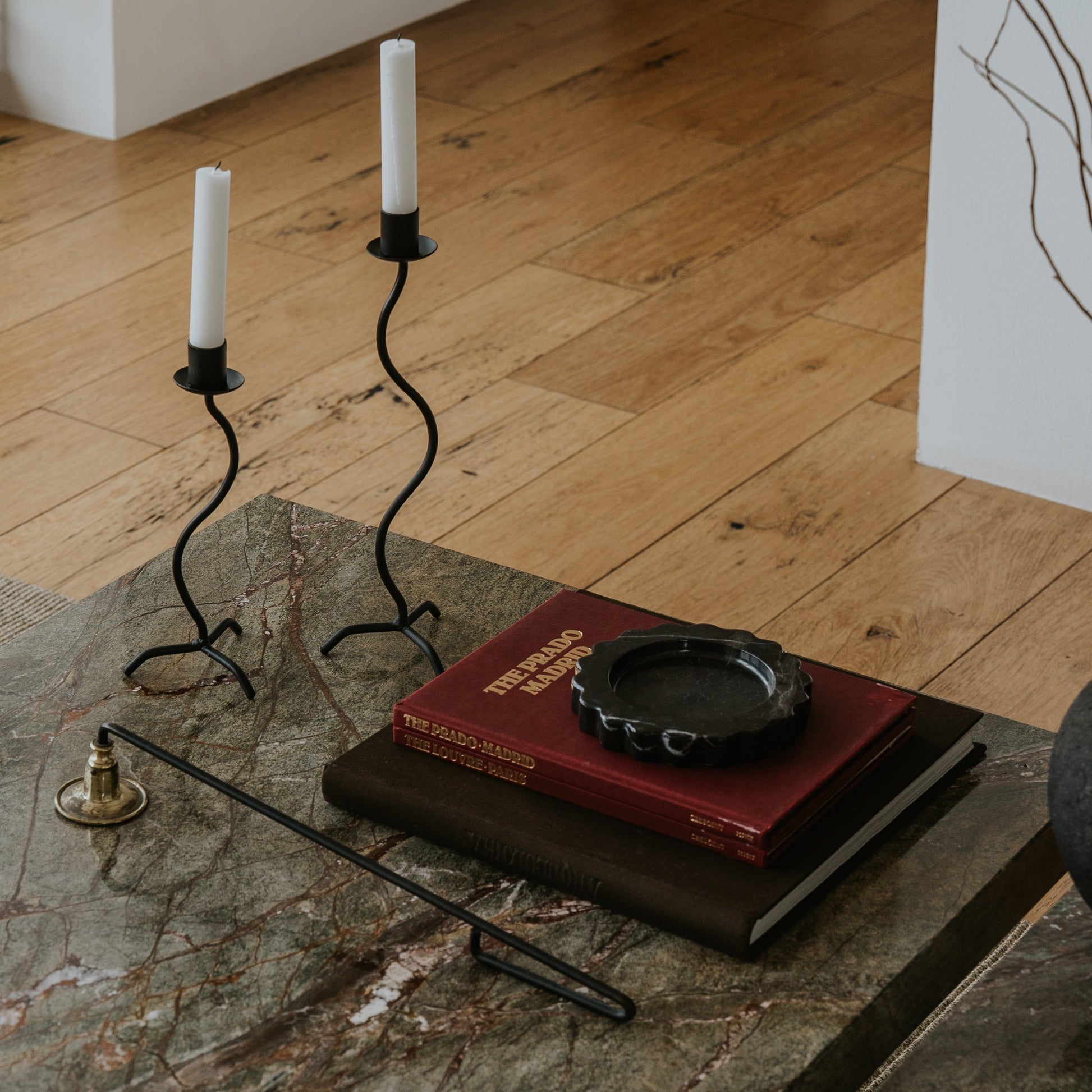 flower-shaped stone tray with candles and on coffee table