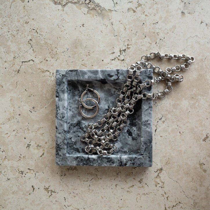 decorative marble valet tray with jewelry and keys