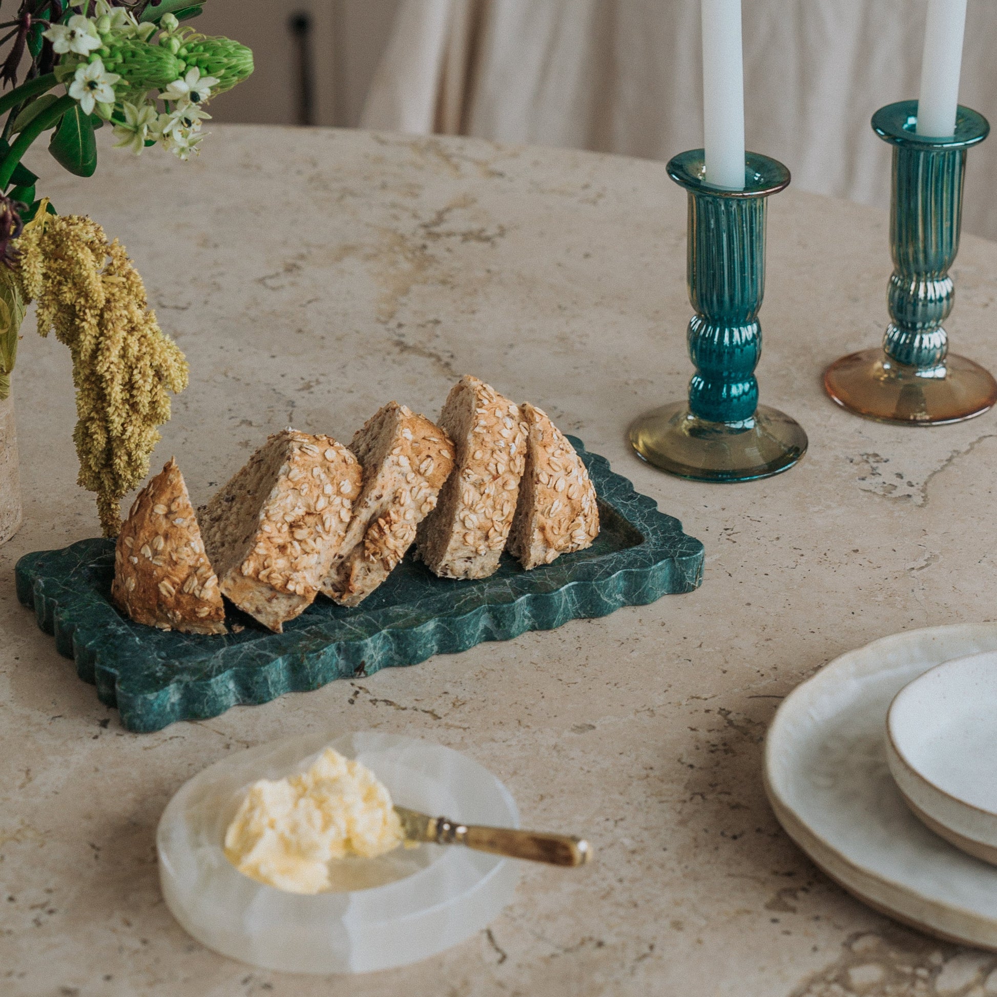 green marble serving tray at dinner party
