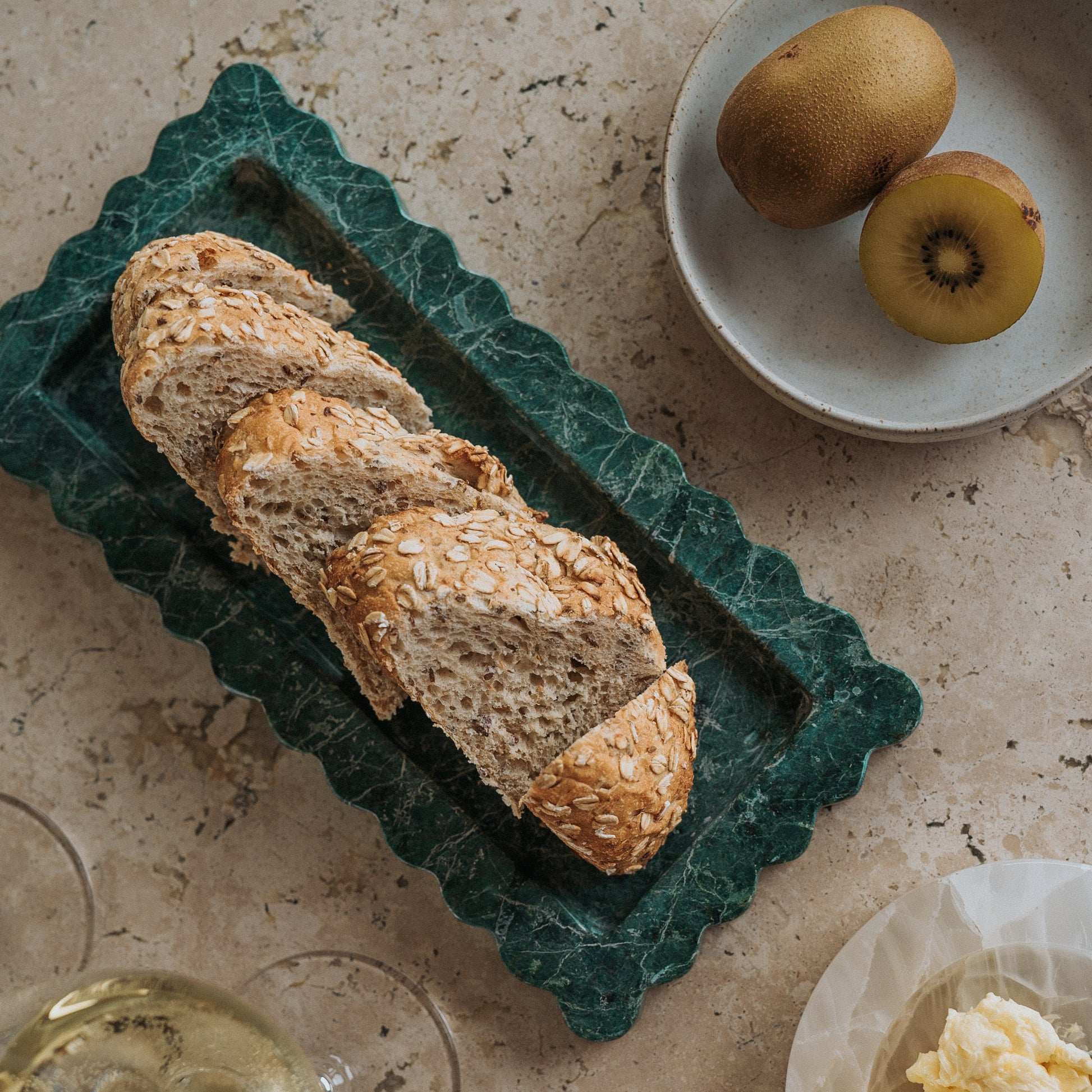 stone tray serving bread at dinner party