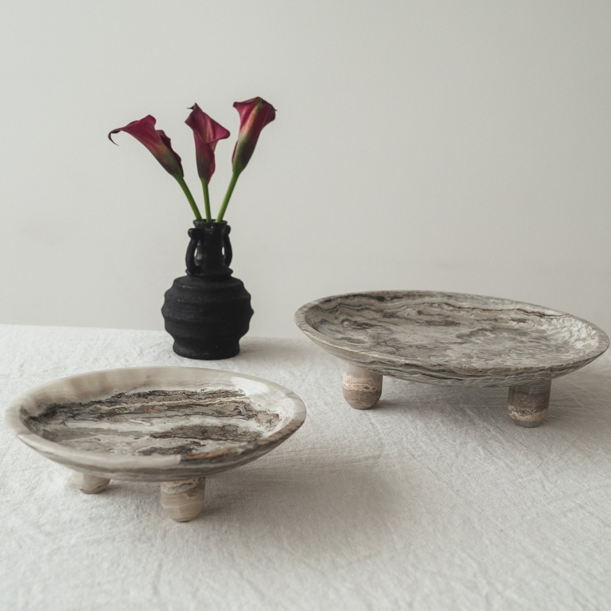 modern stone decor objects styled on table with vase