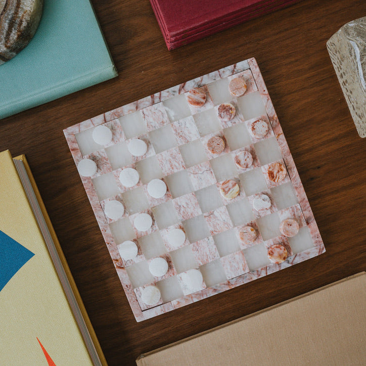 stone checkers game on side table