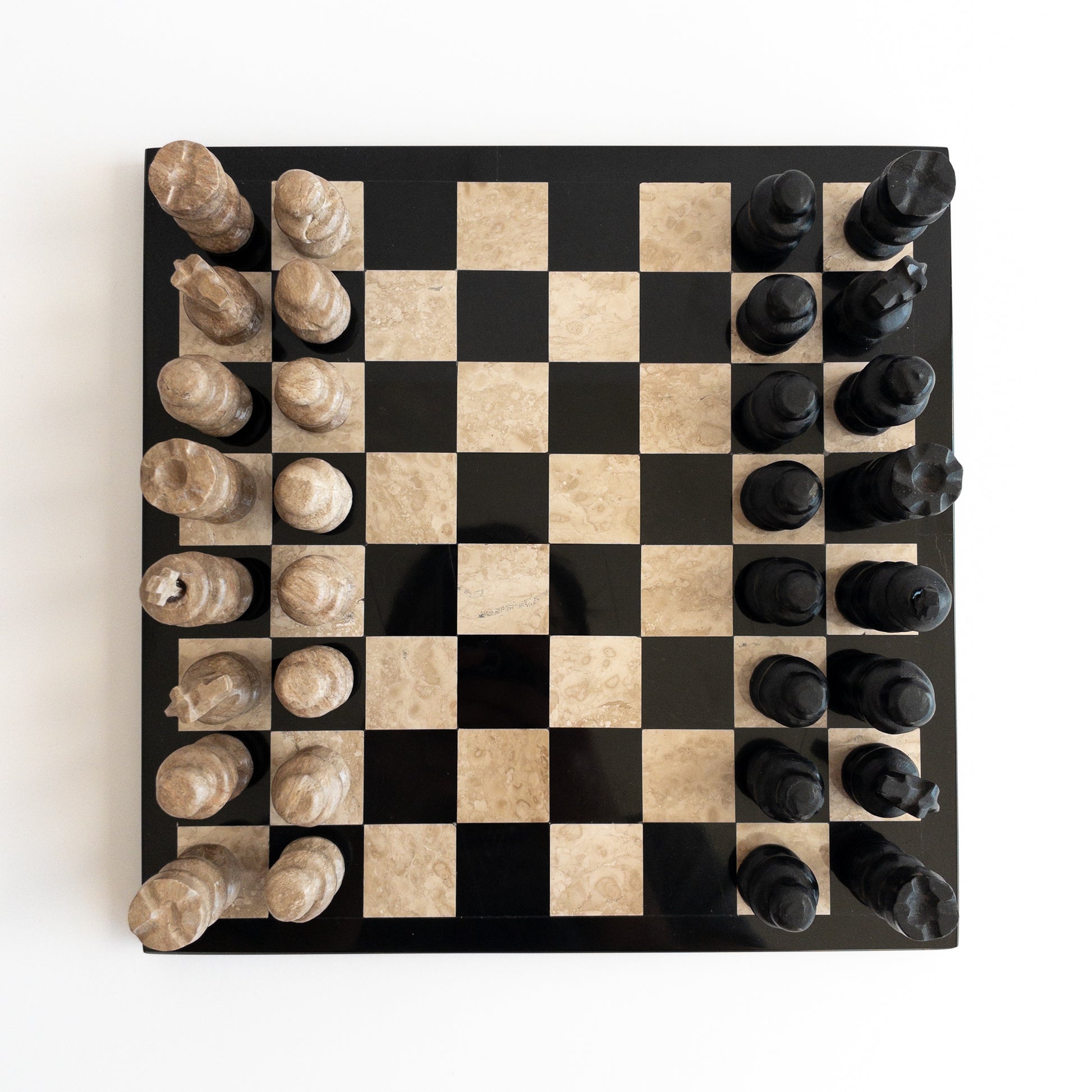 close-up of marble chess pieces with natural veining