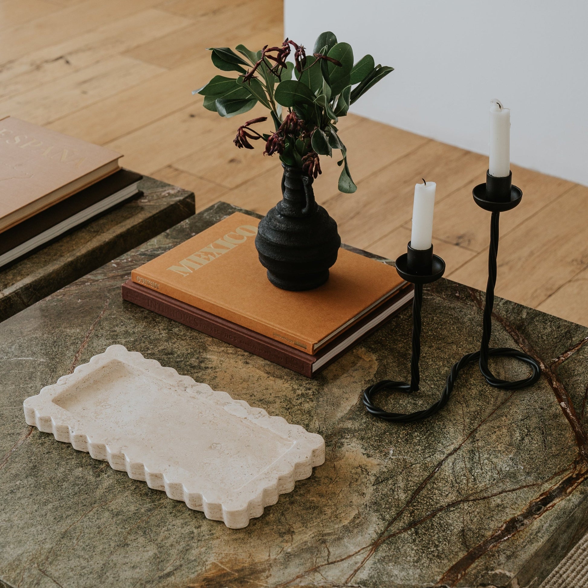 scalloped travertine tray on coffee table