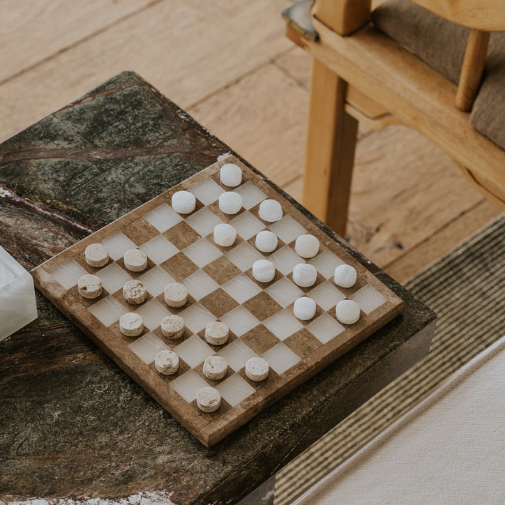 marble checkers game on marble side table