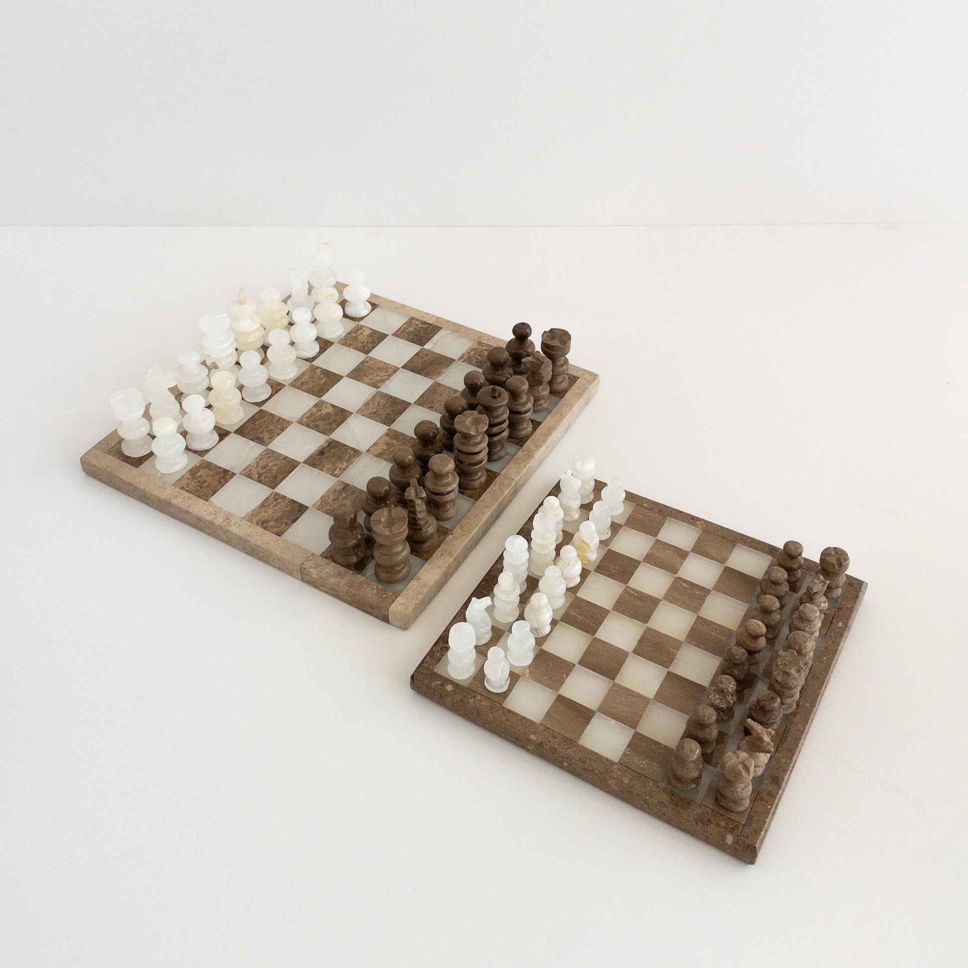 modern coffee table chess set made from travertine and onyx